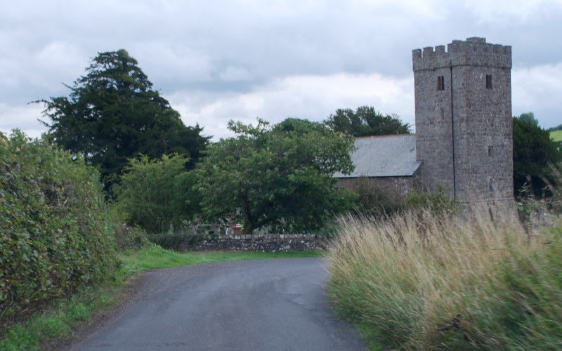 At the bottom of the hill, the church is suddenly in the way and the road swerves to the right.