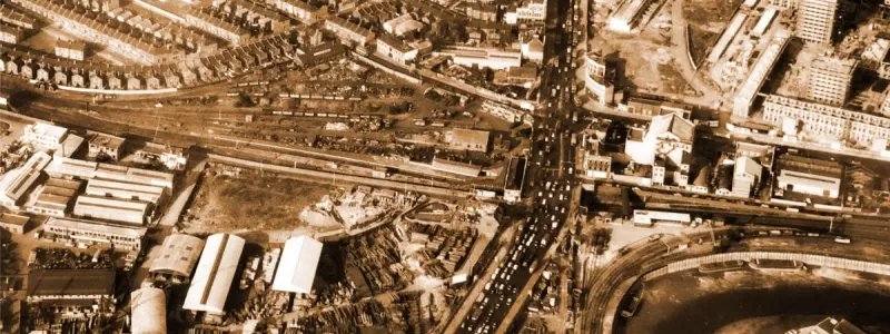 Traffic congestion on the A13 at Silvertown in the early 1960s, where the current Canning Town Flyover stands. A line has been cleared for the straightening of the route to the top right. Click to enlarge.